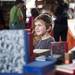 Ann Arbor resident Isley Brown, five, browses books at the Kerrytown BookFest  on Sunday. Daniel Brenner I AnnArbor.com